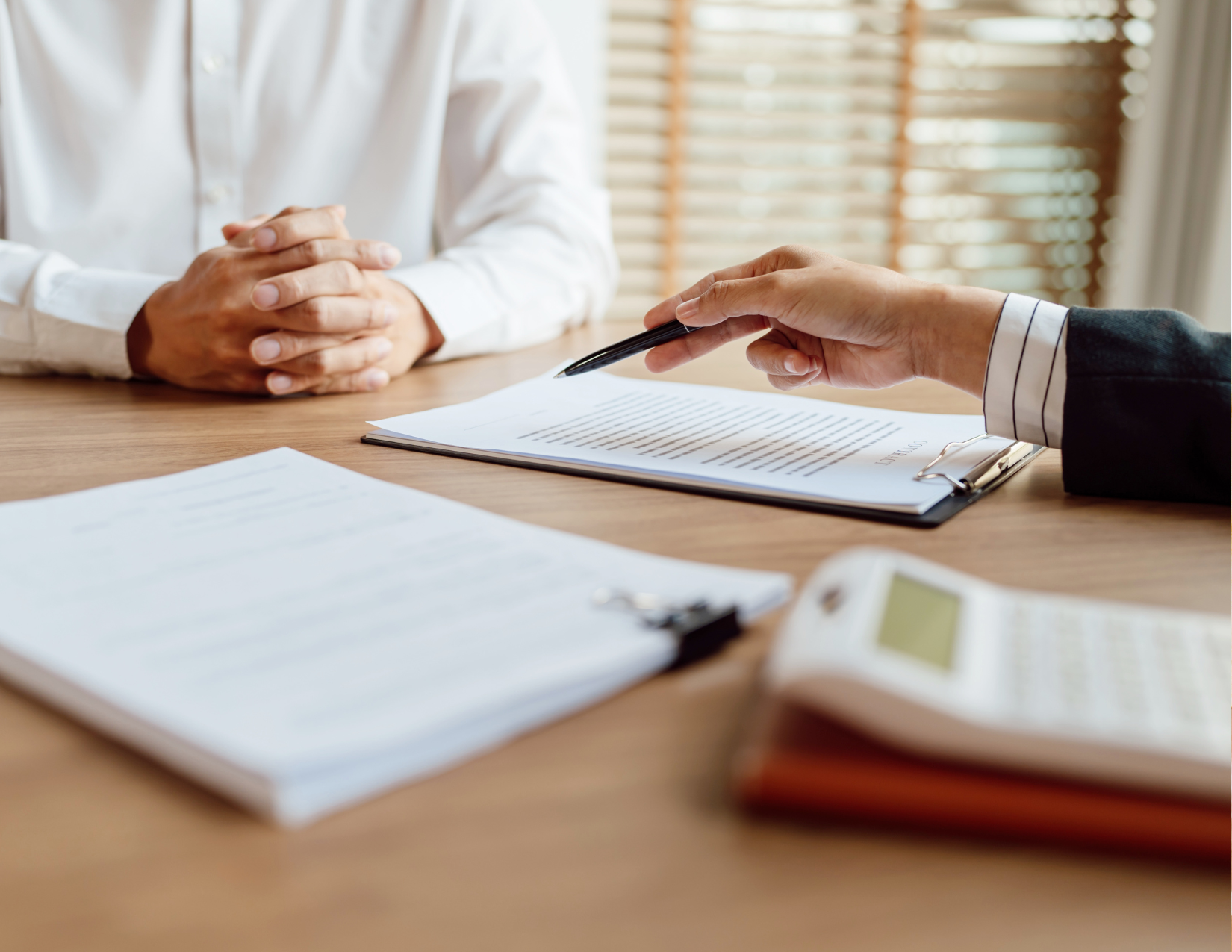 Professional at desk helping client